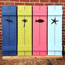 Vinyl cottage shutters are for decorative use and are a hollow backed design with detail on front of shutter only. Beach House Shutters Beach Style Exterior Miami By The Real Cedar Shutter Company Houzz