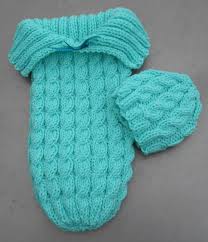 Baby hooded cardigan knit with double moss stitch in sport yarn. Knitted Baby Cocoons Free Patterns You Will Love