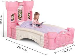 White plastic toddler bed with a plastic base material so that it has a lightweight design and slim. Amazon Com Step2 Princess Palace Twin Bed For Girls Kids Durable Plastic Platform Bed With Headboard Mattress Support Board And Built In Light Pink White Home Kitchen