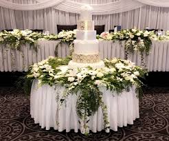 Real flowers add a touch of elegance and romance to your wedding confection. Wedding Cake Table Decorations Broadmeadows Blooms