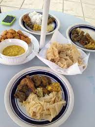 Trinidad And Tobago Local Cuisine Curry Duck Stew Chicken Basmati Rice Curry Goat Buss Up Shot Roti Pholourie Trini Food Caribbean Recipes Island Food