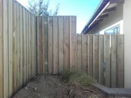 On the outside / public side of the fence, place a picket on each post to cover the post and rail connections. Batten Timber Fence With Gate Urban Fencing Wanaka