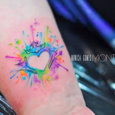 One can also try the arrow piercing the heart symbol to have a dramatic effect on the tattoo. Colorful Heart Tattoo By Monica Gomes Monicagomes Monitattoo Heart Colorful Watercolor Crown Heart Tattoo Watercolor Tattoo Sleeve Small Colorful Tattoos