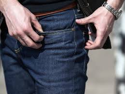 Wet men`s and women`s jeans dry on the balcony. How You Re Washing Your Jeans Wrong According To Experts