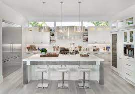 Jun 04, 2021 · a chic modern country kitchen with light stained cabinets and hardwood floors, a white kitchen island, tall stools and pendant lamps a chic modern french country kitchen in creamy shades, with grey stone countertops, lights and a tan tile backsplash is pure chic Kitchen With Island Seating Contemporary Kitchen Design White Modern Kitchen Contemporary Kitchen