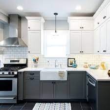 Two Tone Kitchen Cabinets Are One Of The Trends We Love This Year This Vintage Modern Ki Kitchen Cabinet Design Vintage Modern Kitchen Kitchen Cabinets Decor