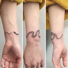 Snake tattoo ideas and a gem or an amethyst look amazing together! 20 Delicate And Exquisite Tattoos Stuffed With Particulars Ouroboros Tattoo Tattoos Tattoo Designs