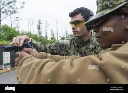 Pistol handling hi-res stock photography and images