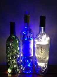 Wine Bottles With Lights For Above Kitchen Cabinets Lighted Wine Bottles Above Cabinet Decor Painted Wine Bottles