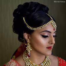 Indian Bridal Hair And Makeup Big Updo Matha Patti Kundan Jewels Sparkling Eyes Red Lips Modern Indian Bridal Hairstyles Bridal Hair And Makeup Big Updo