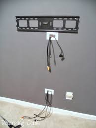 Attach the wire or cable to a fish tape or coat hanger using electrical tape, and feed it into the hole until it reaches the opening at the other end. Ideas To Hide Wall Mounted Tv Cords Novocom Top