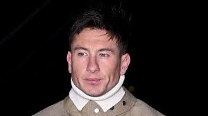 Barry Keoghan shows off his snazzy sense of style in a sharp camel co-ord  as he brushes off his BAFTAs snub to head to London Fashion Week's Burberry  show