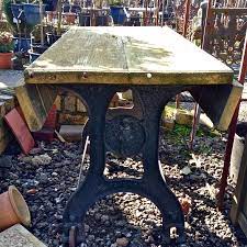 This table is made of reclaimed wood and as a result contains characteristics of wood including the following: Antique Wooden Topped Cast Iron Table V V Reclamation