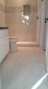 While the bright tone appears from the large, tan tiles that cover most of the bathroom's walling and flooring. Ultra Modern Marble Tile Bathroom Remodel San Tan Remodeling