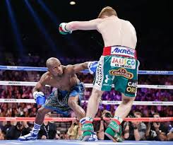 Mayweather Goes Low Against Canelo In The First Round Eric Jamison Ap Floyd Mayweather Tv Entertainment Canelo Alvarez