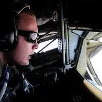 Capts. Rick Ford and John Gustafson, pilots with the 136th Airlift Wing  181st Airlift Squadron, Dallas, Texas Air National Guard, flies a C-130  Hercules aircraft loaded with supplies to Entebbe, Uganda -