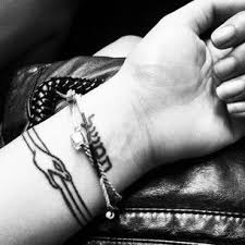 Ouroboros tattoos is a powerful reminder to live in the moment and be positive by hoping that a new cycle is always coming. A Hebrew Phrase Or An Ouroboros Wrist Tattoos For Guys Cool Wrist Tattoos Wrist Tattoos