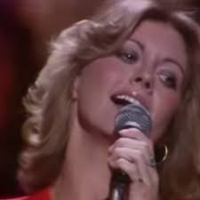 A Little More Love » es una canción grabada por la cantante  británico-australiana Olivia Newton-John. En Estados Unidos, alcanzó su  punto máximo, el número tres, en el Billboard Hot 100 en