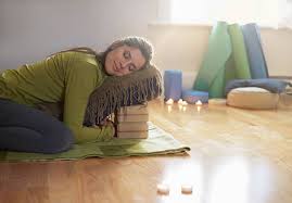 Restorative yoga pose in warm golden light