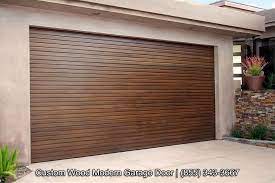 Custom Designed Modern Wood Garage Doors With Horizontal Staggered Wood Slat Design Sectional Automatic Garage Garage Doors Garage Door Design Modern Garage