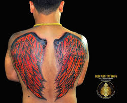 This tattoo is usually hidden from view under clothes. Angel Wing Tattoo Man Novocom Top