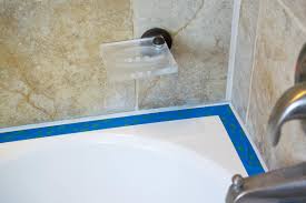 This article explains how to clean the old caulk out and then recaulk around a shower or tub. How To Caulk A Bathtub Or Shower Surround Craving Some Creativity