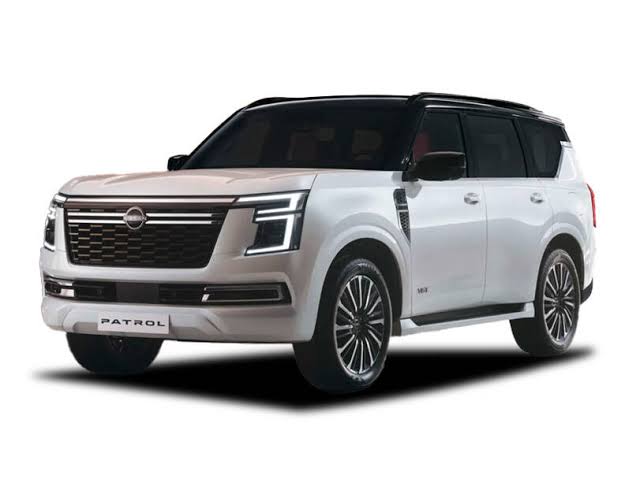 White Nissan Patrol full-size SUV showing front and side exterior design with bold grille, LED headlights, and premium styling|Arabwheels.ae