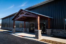 a timber frame entry really dresses up this metal building nice work from green mountain timber frames inc timber framing metal buildings house styles