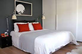 This graphic punch was easy to accomplish with a trio of craft store frames, white butcher paper as matting and red construction paper as the art itself. Bold Black And White Bedrooms With Bright Pops Of Color
