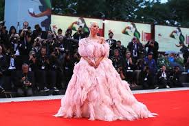 Maybe you would like to learn more about one of these? Lady Gaga Wears Pink Feathered Valentino Couture Gown To Venice Film Festival