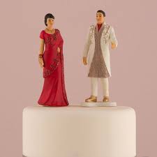For the more whimsical side, we have a cake topper with a bride pinching the grooms backside or a comical bride dragging the groom to the altar. Traditional Indian Bride Groom Wedding Cake Topper