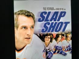 What 1977 sports comedy movie starring Paul Newman is being referred to?