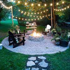 Create Your Own Outdoor Space For The Winter Weary We Can Help You With Bricks Pavers And Retainingwallbloc Backyard Lighting Backyard Rustic Backyard