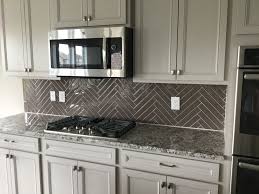 Feature tiles contemporary kitchen backsplash shower backsplash subway tile bathroom shower bathroom shower tile glass tile backsplash beach house bathroom contemporary bedroom furniture bathroom makeover. Color Wave 2x12 Glass Tile In Herringbone Pattern Greige Kitchen Kitchen Remodel Idea Kitchen Tiles