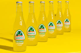 Orange Juice Bottle On Yellow Surface Photo Free Label Image On Unsplash