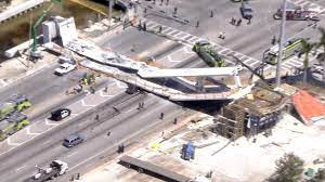 A pedestrian bridge collapsed onto a highway in washington, d.c., injuring fivepeople, officials say. Watch Live Officials Give Updates On Miami Bridge Collapse