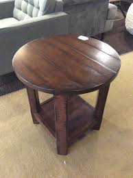 Dark wood side table previously used for a side table in living room. Round Dark Wood Side Table Sold Ballard Consignment