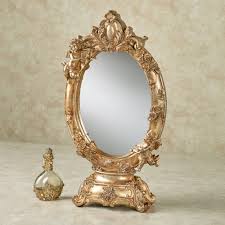 Aurelie Cherub Tabletop Vanity Mirror Available in bright white, and pro black. aurelie cherub tabletop vanity mirror