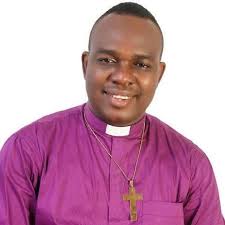 African god Anansi helping white Jesus off the cross to prepare him for his  ascension.