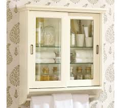 Glass cabinet doors simply replace the center wood panel with your glass choice. Sliding Door Wall Cabinet Pottery Barn