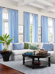 White Walls With Contrasting Black Windows Mixing Metal And Wood Furniture And Round And Rectangu Small Living Room Decor Living Room Designs Home Living Room