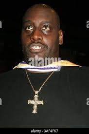 New York Knicks Anthony Mason, left, sticks his tongue out at Chicago Bulls  Will Perdue, right, as Bulls Horace Grant (54) acts as peacemaker during  the fourth quarter of a 100-86 Knicks