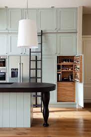 Since the face frames overextend the sides of the cabinets by 1/4 (this is done so the cabinets will line up square at the face frame, regardless of how square the carcass or walls are) we can just take 1/4 birch plywood and prime and paint it to match the face frames, and glue and tack it on over the ends to finish out the ends. What About Inside The Kitchen Cabinets