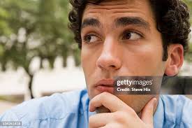 Pensive Young Man High-Res Stock Photo