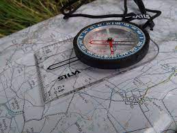 First, you'll need to be able to find at least two known landmarks. File Compass On Map Jpg Wikimedia Commons