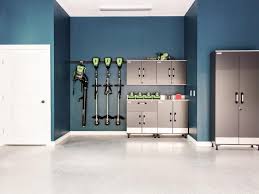 The Home S Well Organized Garage Includes A Workstation Smart Storage Solutions And Interior Walls Paint Garage Interior Dream Home 2017 Garage Interior Paint
