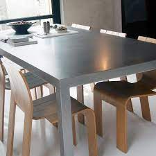 Stainless steel tables include brushed finishes and engineering wood to create a stunning look for any dining room. Stainless Steel Dining Table Merito Rvs