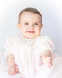 Name something sweeter than a baby girl in a handmade heirloom dress. 🤍  Heirloom portraits in our Lillian heirloom are a must when documenting her  sweet baby years. Choose your pastel batiste,