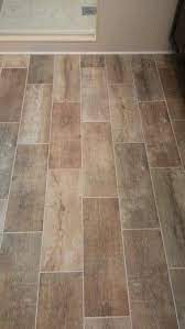 Learning how to lay floor tiles is a fairly simple process, but it's something that takes a bit of preparation. Wide Plank Tile Floors My Sister N Law Has This And It S Hard To Tell It S Not Real Wood Love It Plank Tile Flooring Flooring Wood Plank Tile