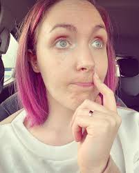 this is the face of someone who's just out of work after a pretty long day,  went to the shops and only after going through the checkout having gone  round the whole